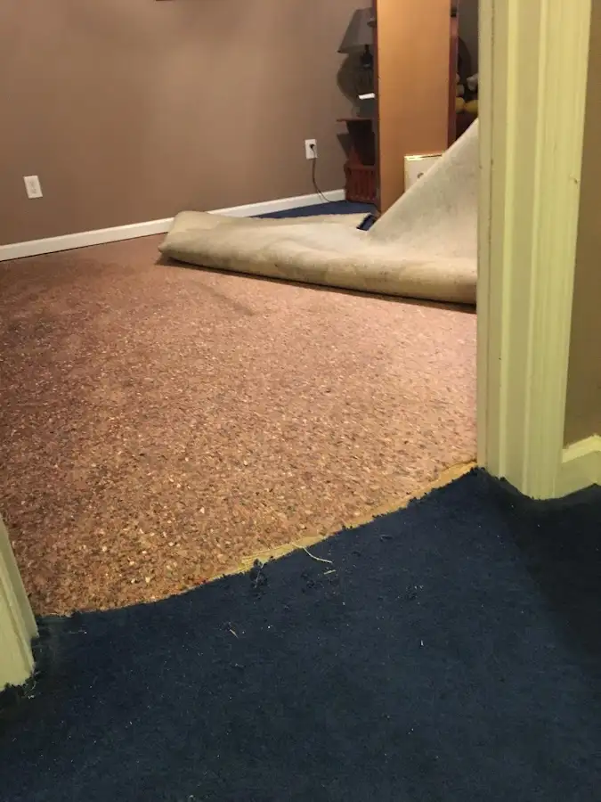 Carpet pad removal revealing water damage during Drying & Dehumidification in Prescott